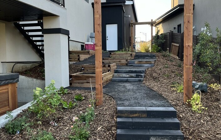 An arbour separates the veggie area